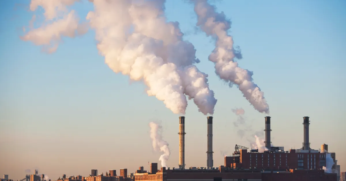 Image of industrial smokestacks.